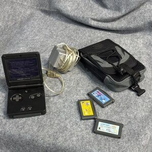 Nintendo Game Boy Advance SP Handheld Console  with charger and 4 games and bag